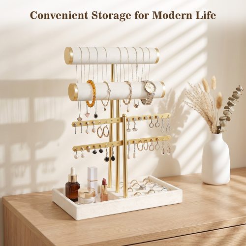 Gold velvet jewelry organizer on wooden dresser with necklaces earrings bracelets and cosmetics